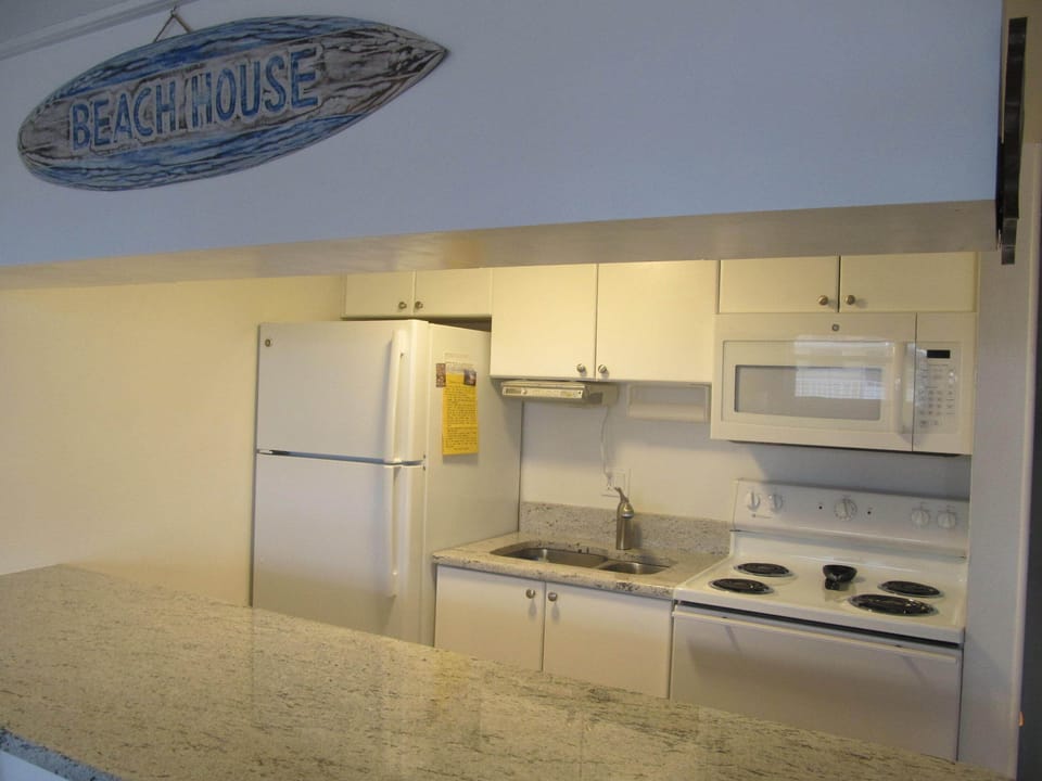 Updated Kitchen with 
new granite counter tops and appliciances.