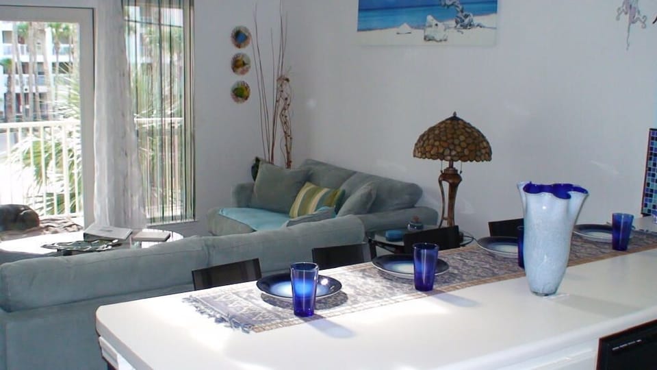 Breakfast bar with seating for four open to living room and kitchen.
