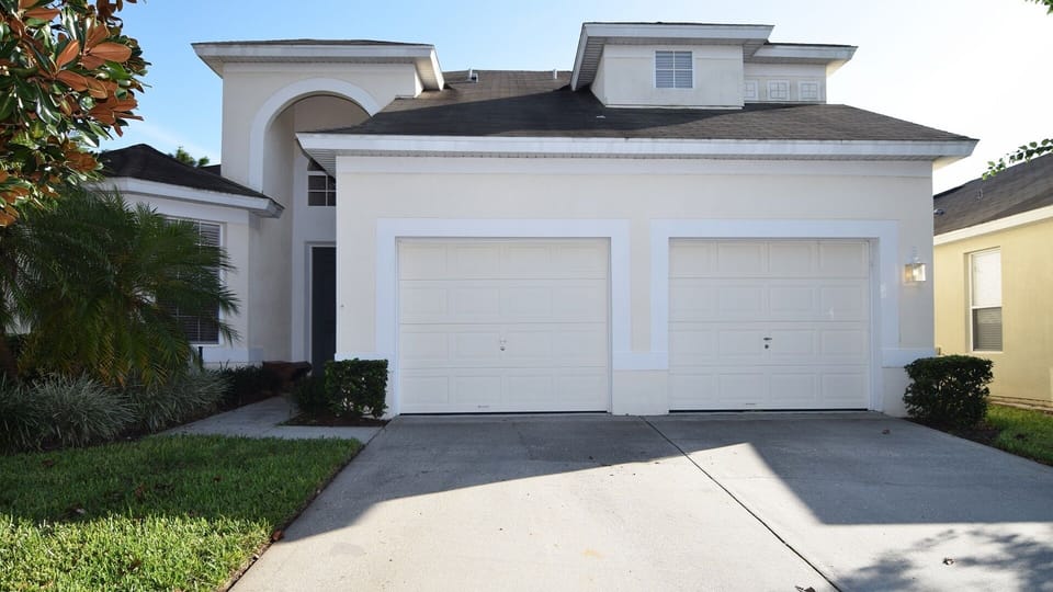 Front of this beautiful pool home with parking for two vehicles