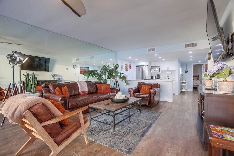 Living room and kitchen with foyer to back guest bed and bath
