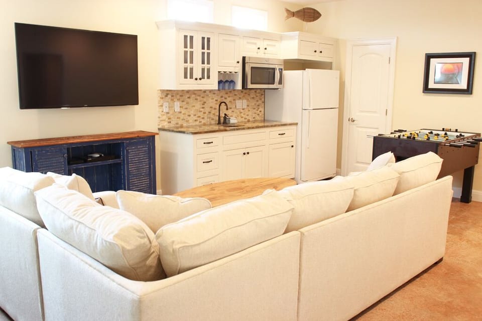 1st floor game room with smart TV, free wi-fi, foosball and shuffleboard.