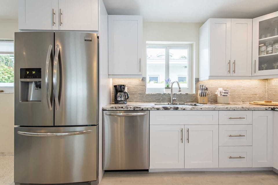 Fully equipped kitchen has all new stainless appliances and granite counter tops.