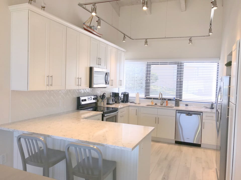 New kitchen, bar seating, new appliances, lighting, cabinets