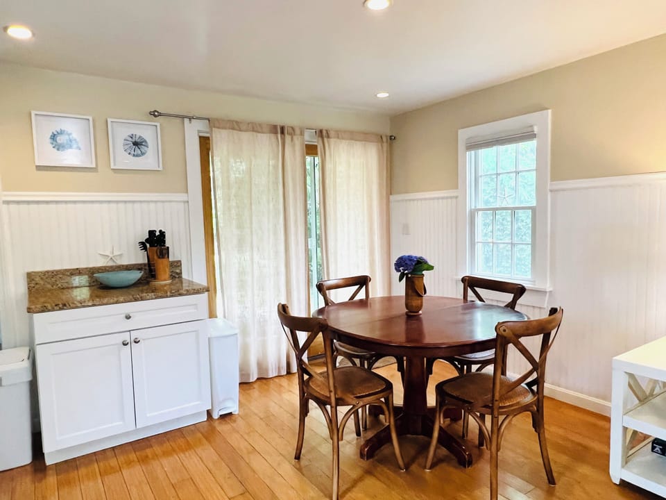 Dining area with sliding doors to back patio/outdoor shower
