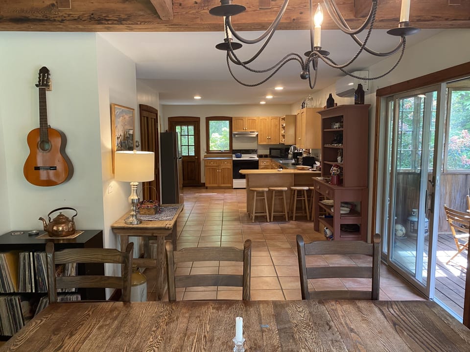 Open layout connects the living room, dining room, and kitchen