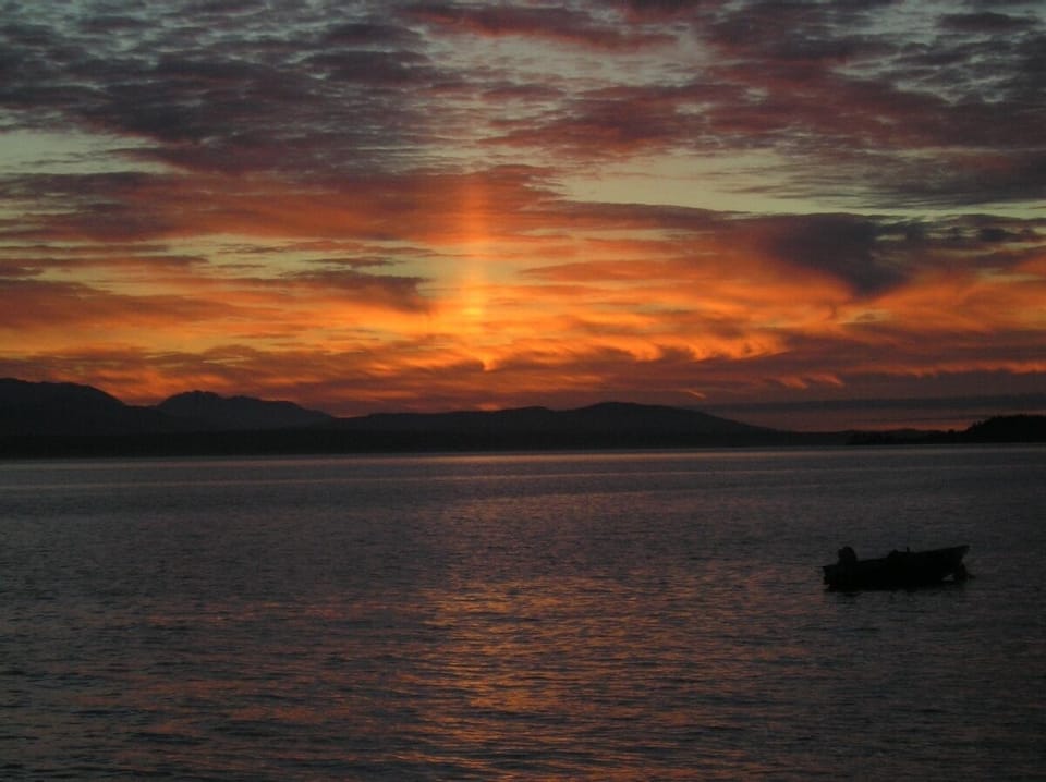 Sunset over the Olympic Mountains from deck