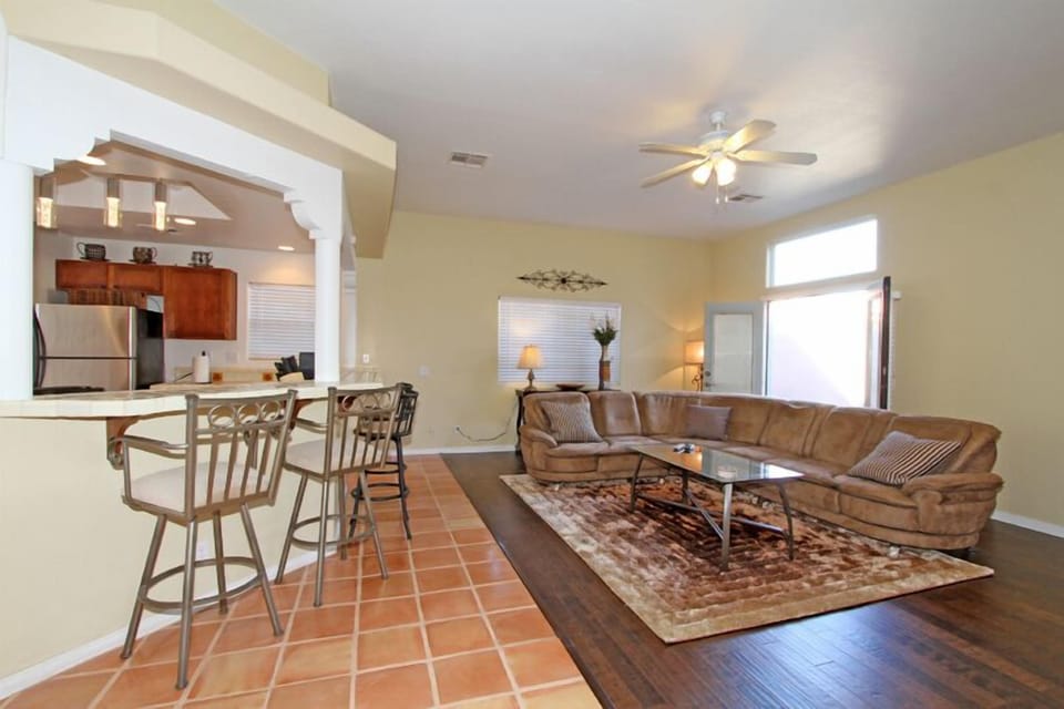 Living room french doors open to back patio.