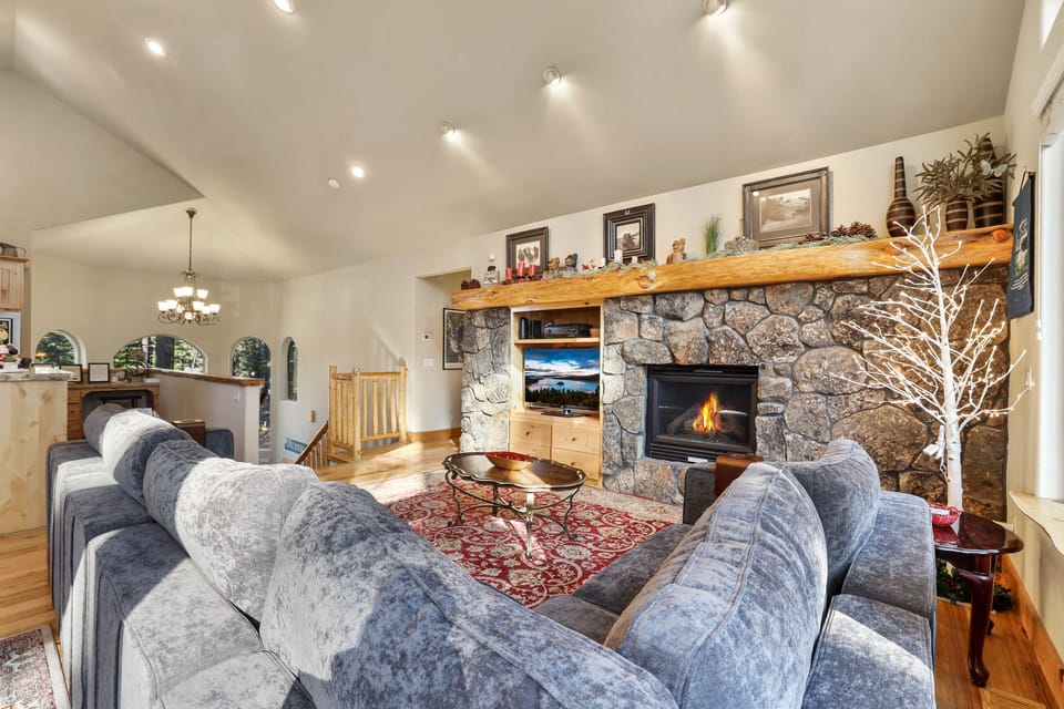 Living room with entertainment center, surround sound and a fireplace