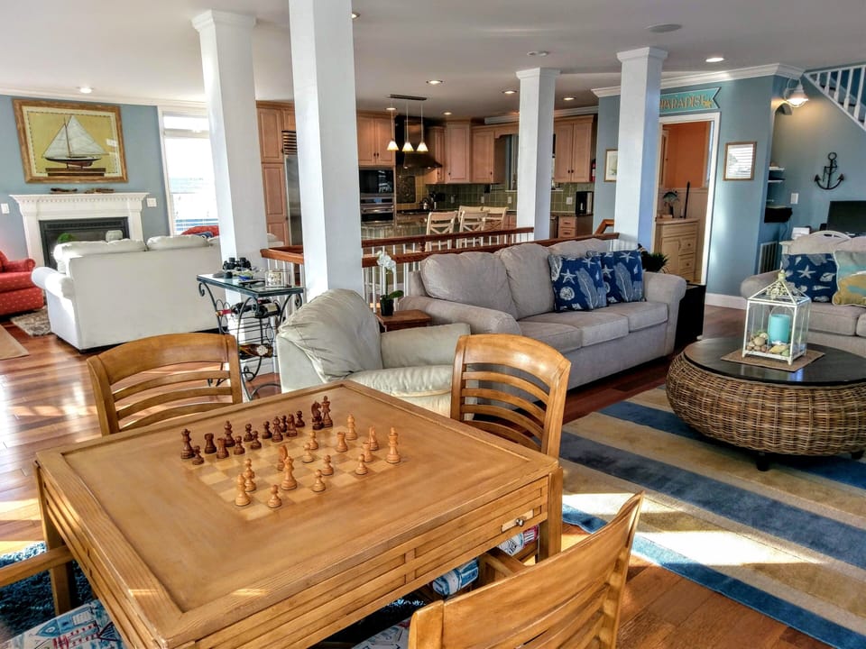 Top floor offers multiple sitting areas. Open floor plan
