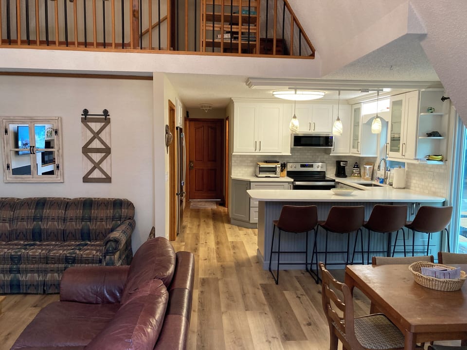 Kitchen adjacent to TV Room and Dining Area- Lake View and Deck Access