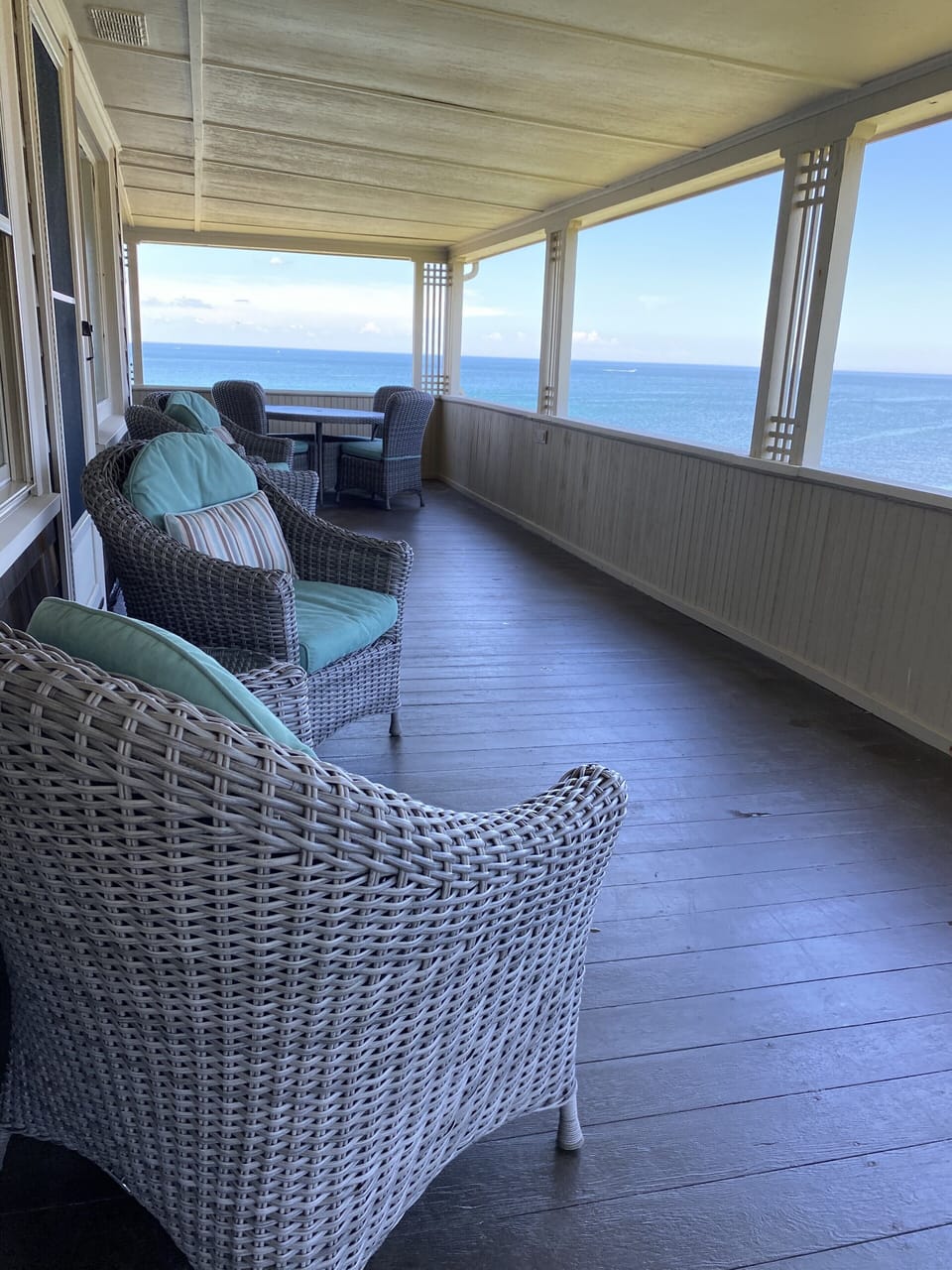 Notice the ocean views that envelope this wide, side wrap-around porch! 