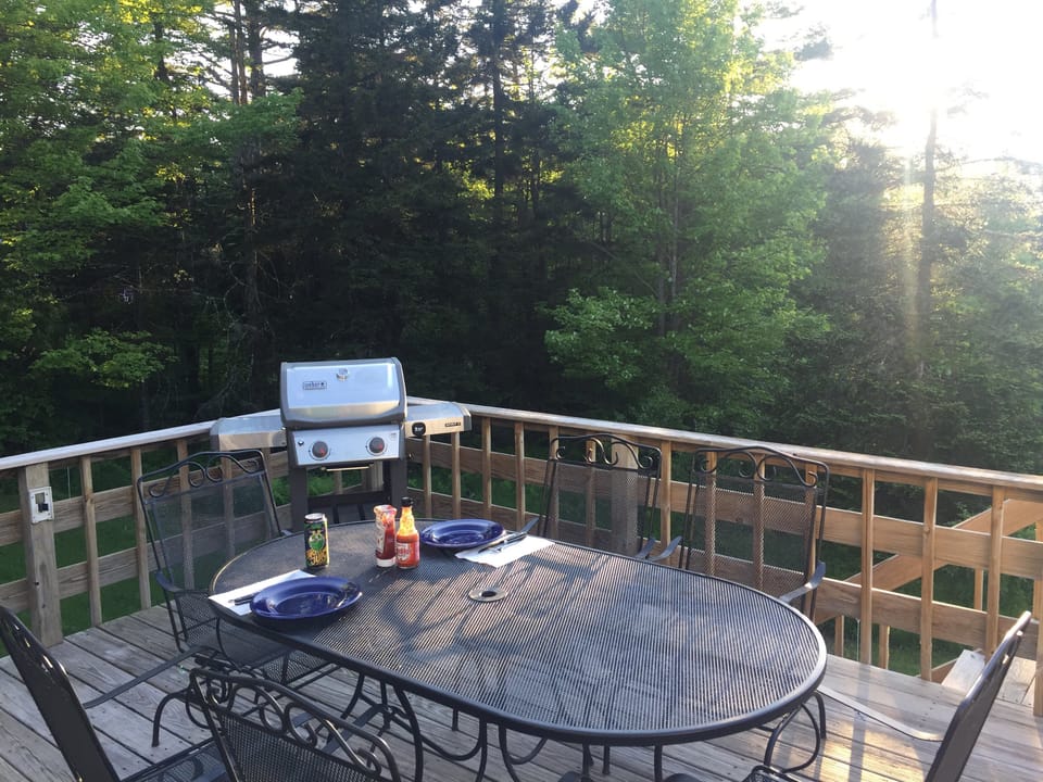 Look out at the mountains while relaxing on the deck.