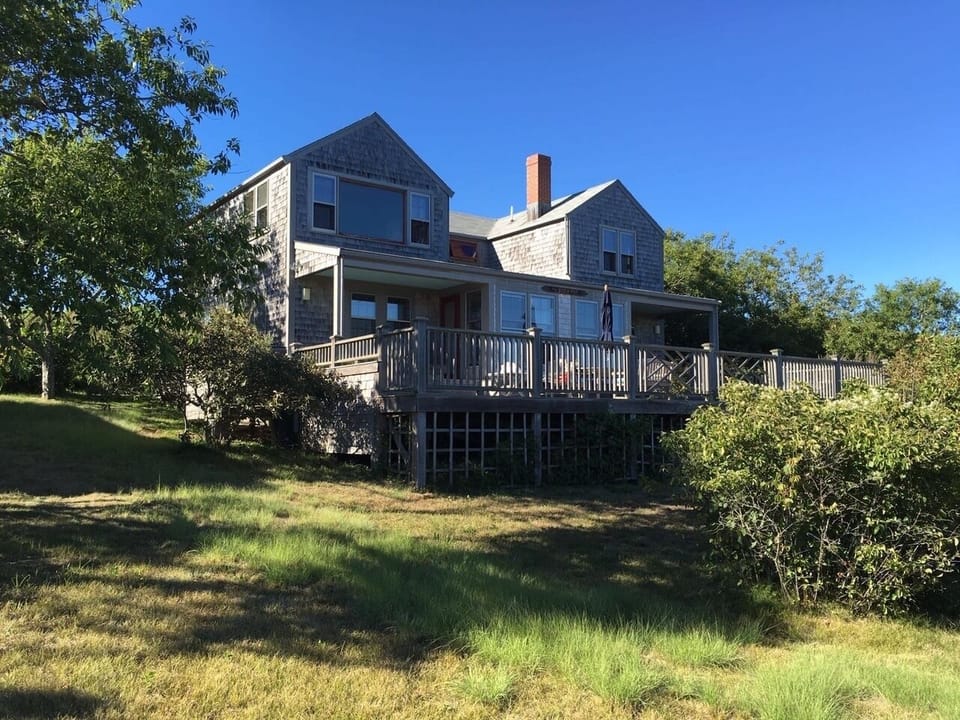 Stewpot sitting on a hill overlooking Quidnet Village and ocean