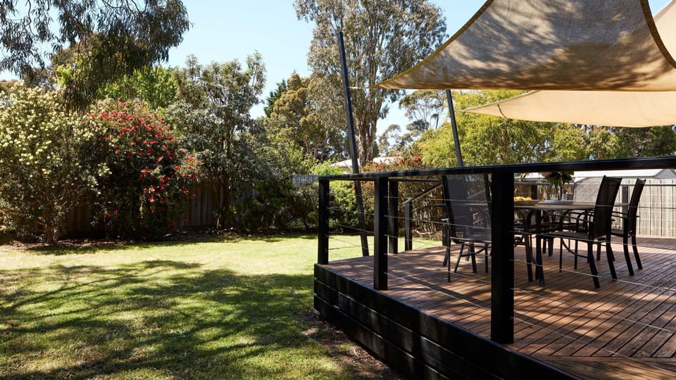 Outdoor deck area and backyard.