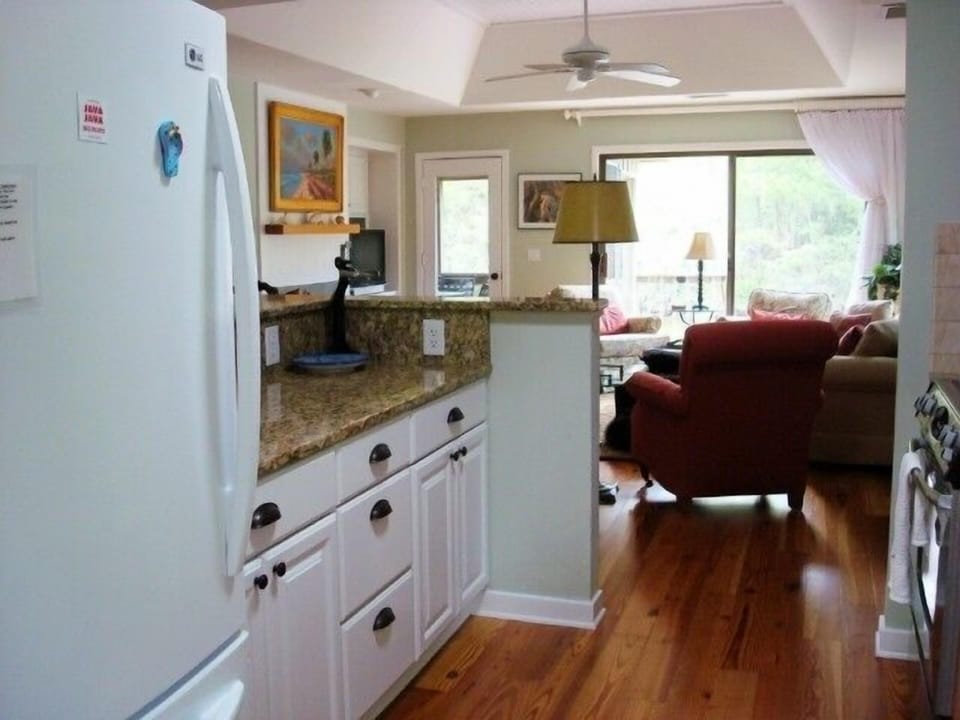 Gourmet Kitchen which opens into den