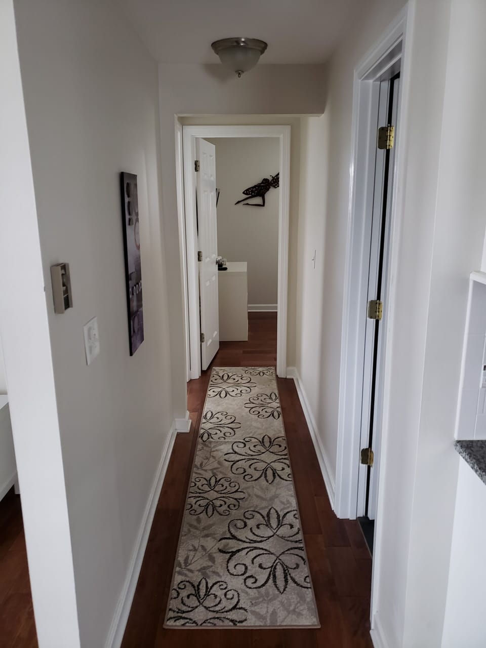 Hallway has bathroom on right, 1 br on left, 2nd br at the end of hall