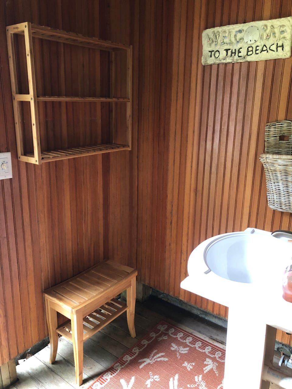 Changing area with sink in the outdoor shower.