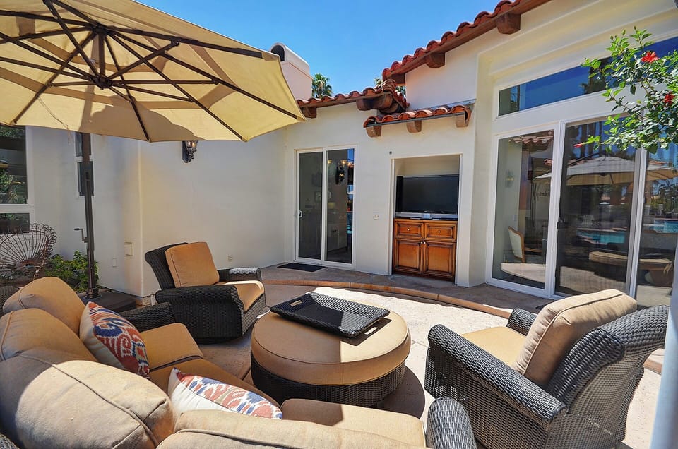 Outdoor Living Room Has TV