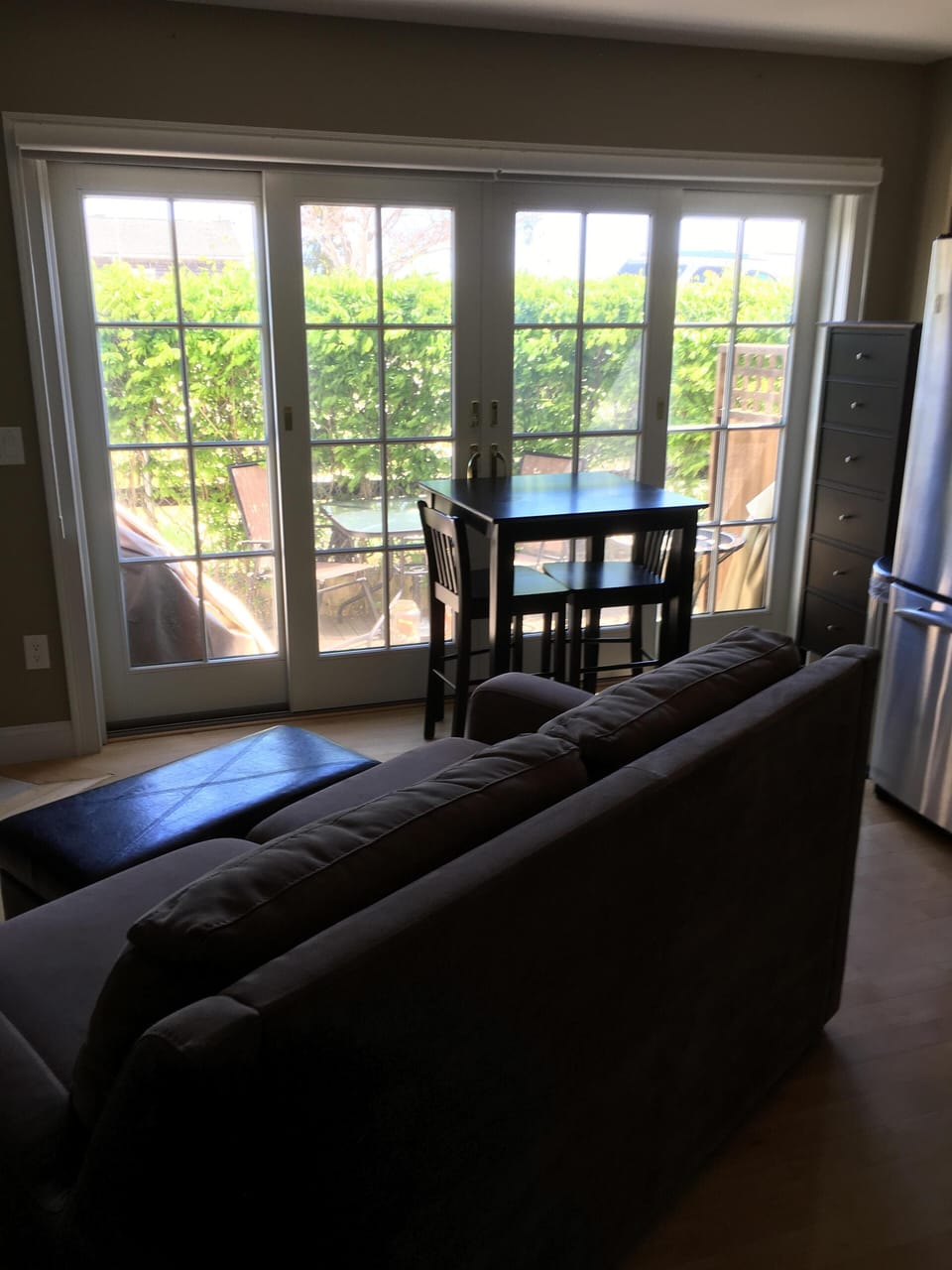 Living room. Double doors open to the deck