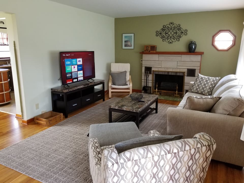 Roku TV, new furniture and a computer station.