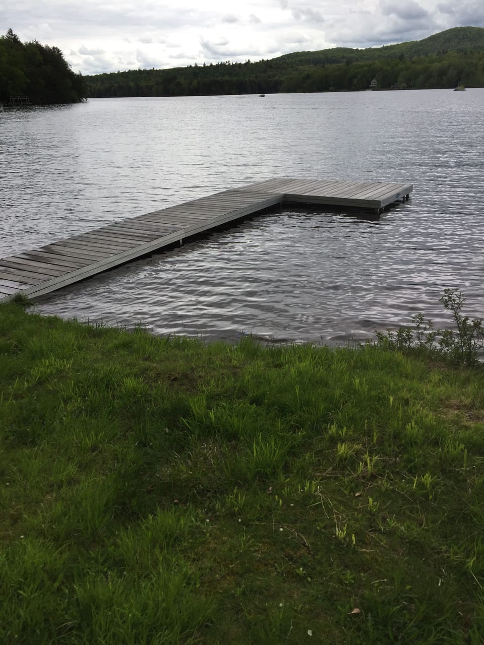 Dock. About three feet deep at end of dock, and deeper further out. 