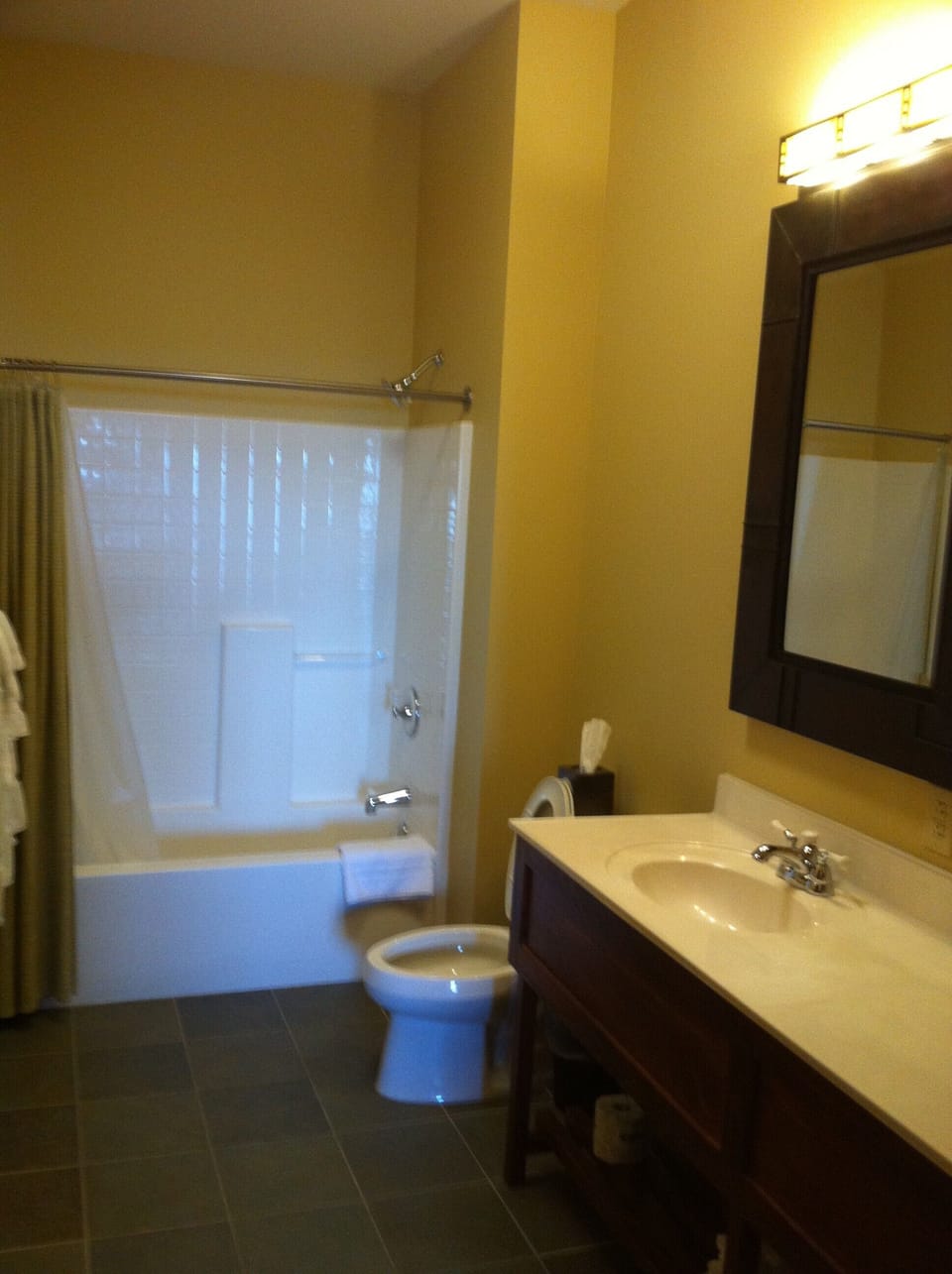 Expansive Bathroom with shower-tub & natural  tile