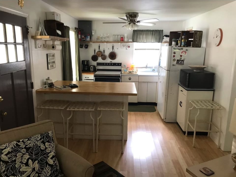 Fully equipped, spacious kitchen. Butcher block counter. Bar seating. 