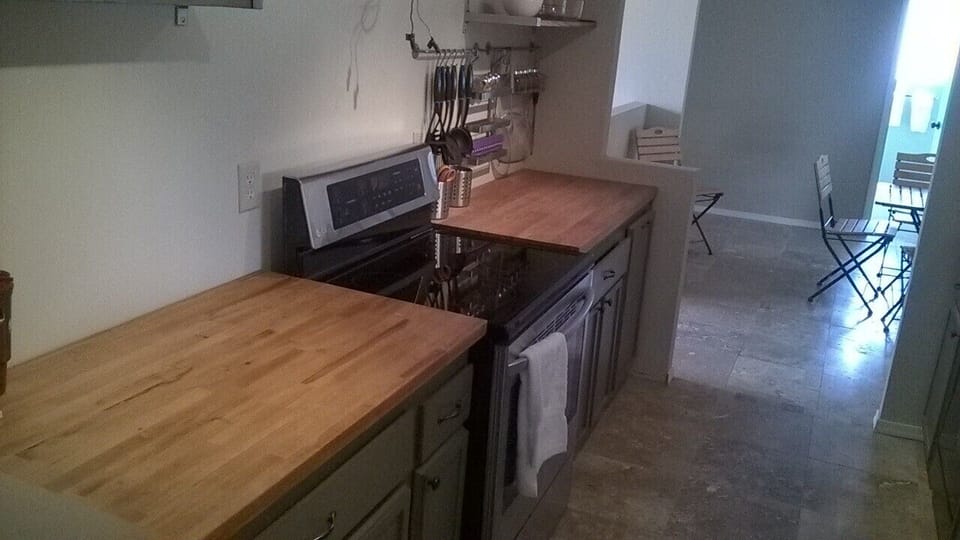 Glass top stove with convection/microwave above butcher block counters