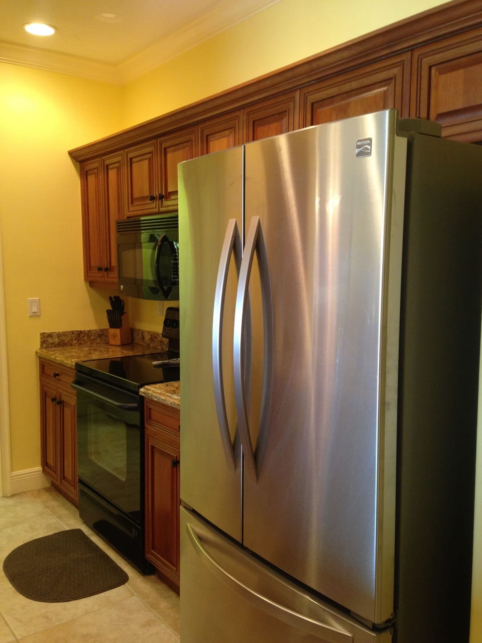 Kitchen with New French door refrigerator with ice cold water dispenser inside!
