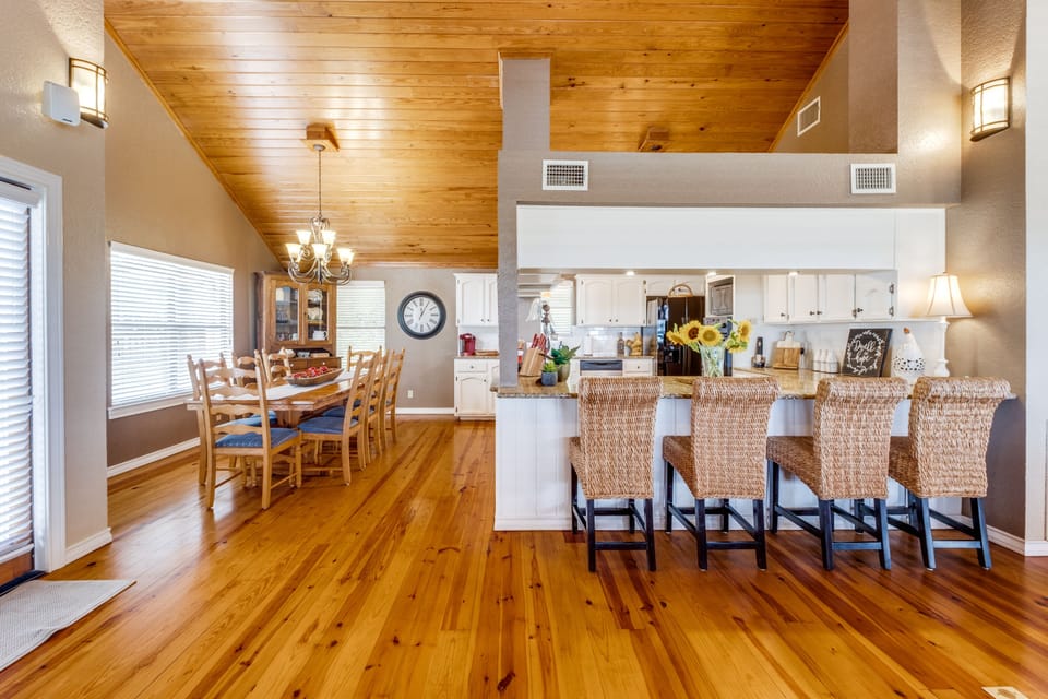 Dining area with seating for 8 and 4 counter bar stools.