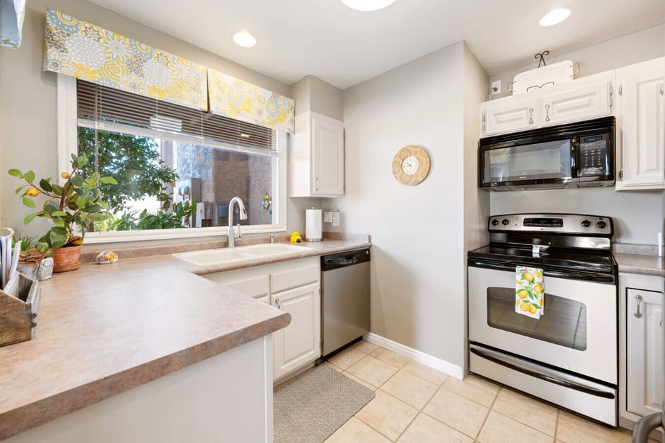 The fully-equipped kitchen with stainless steel appliances and everything needed for everyday cooking - also amazing views!