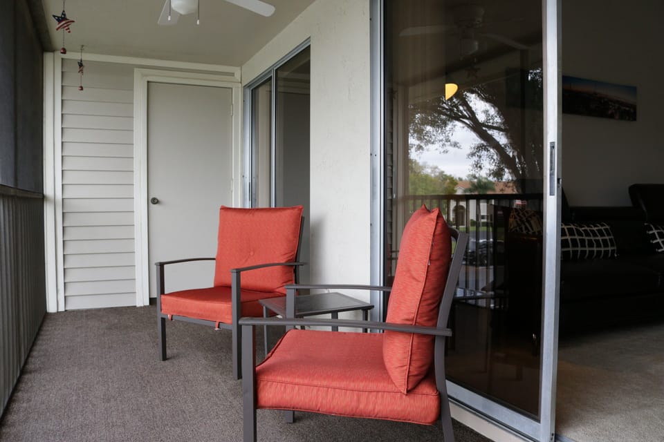 SUMW13 - Sliding doors from the living to the large screened in balcony.