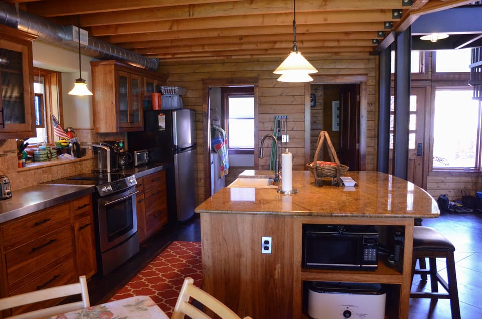 Another view of the kitchen and island