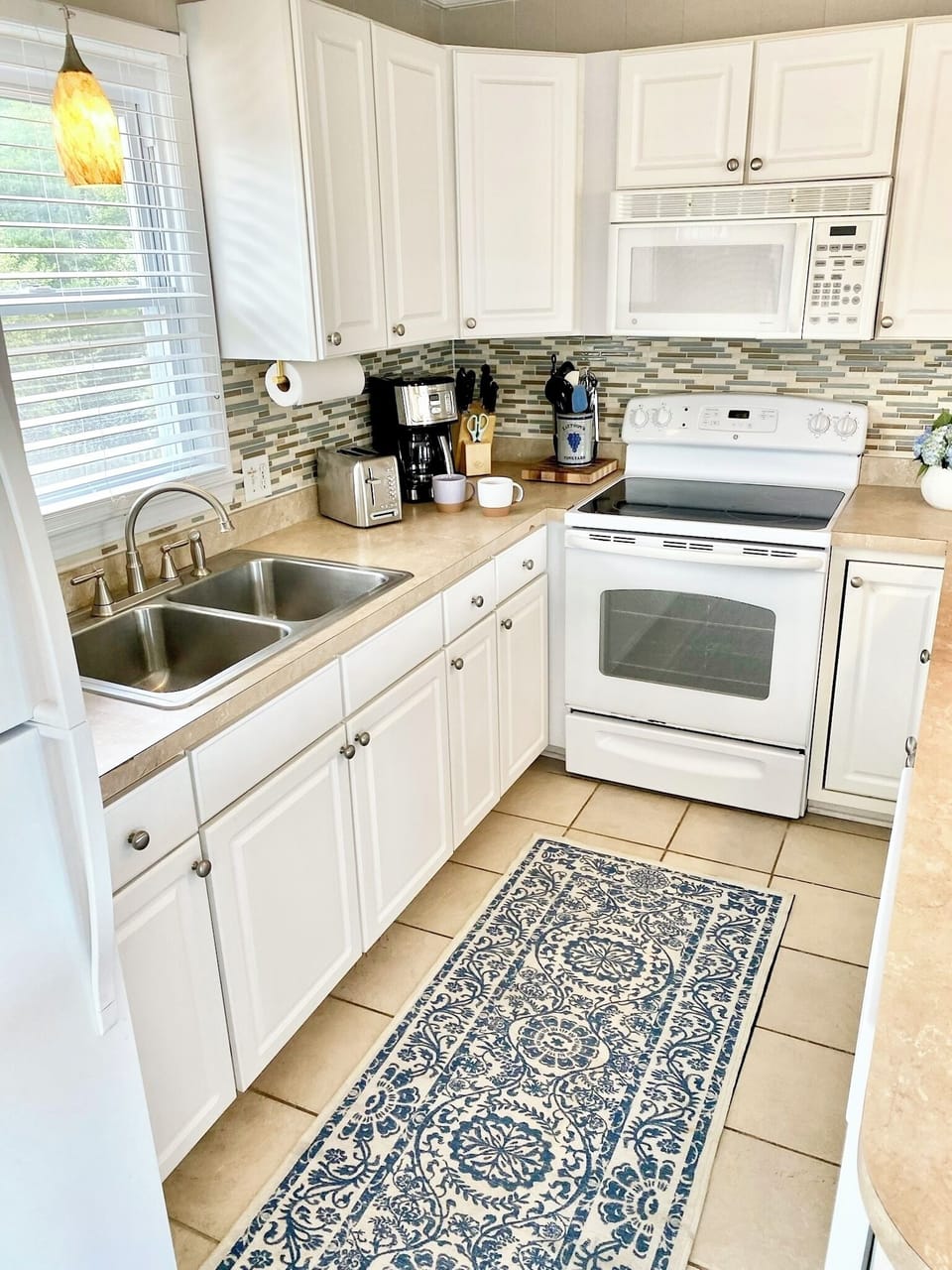Kitchen comes equipped with essential cooking tools and spices