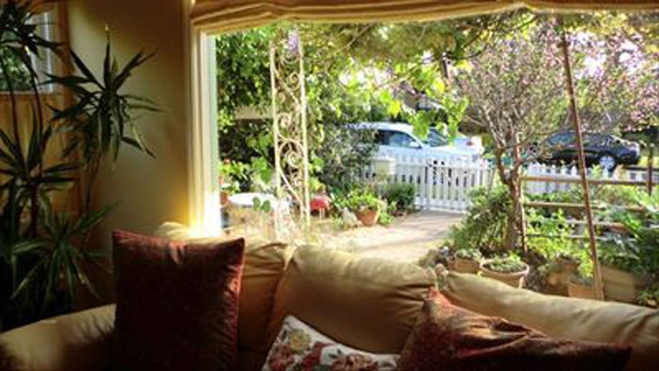 Large Living Room with Picture Window Out to   Front Gardens and Gated Picket