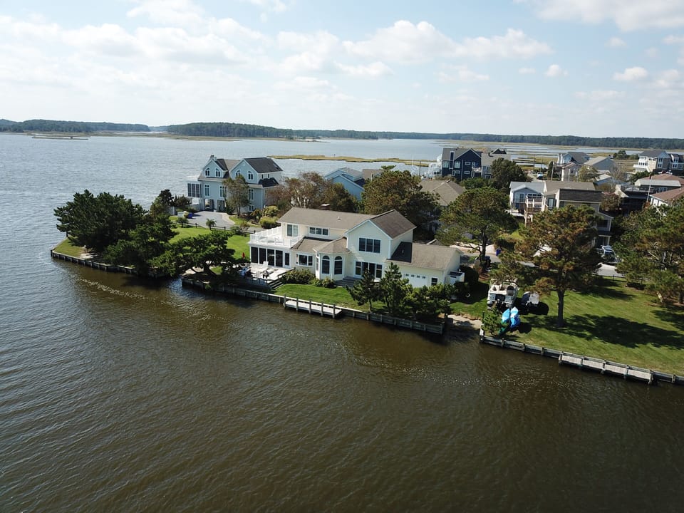 Aerial view of the house, cove, and bay. Courtesy of guest, C. Stahley!