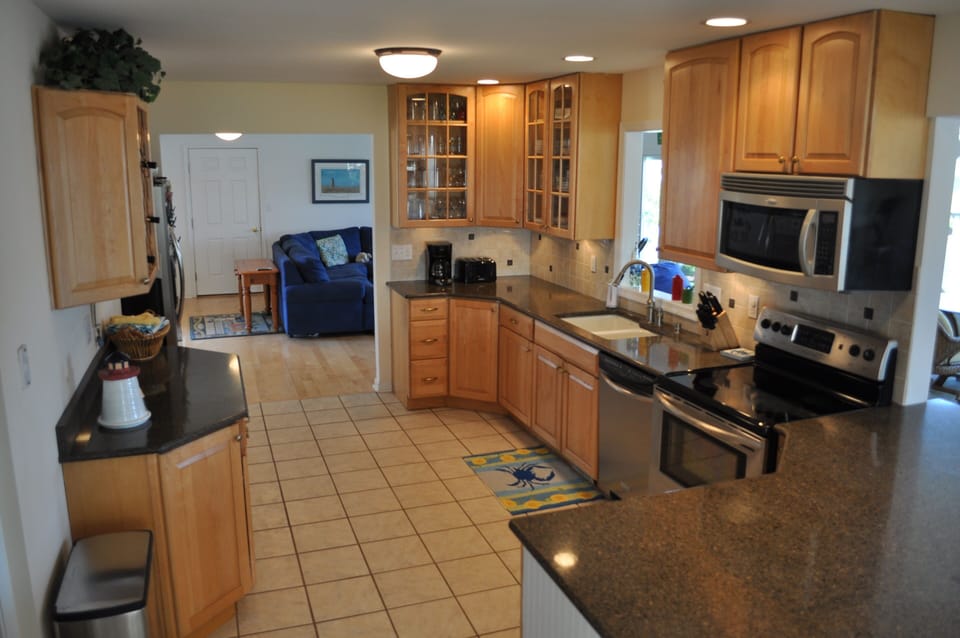 The fully-stocked kitchen has counter seating for four.