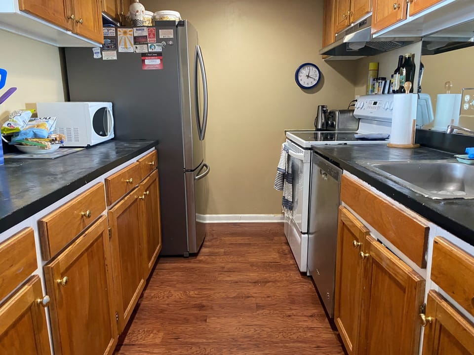 Fully stocked kitchen with blender, keurig,  and drip coffee pot.