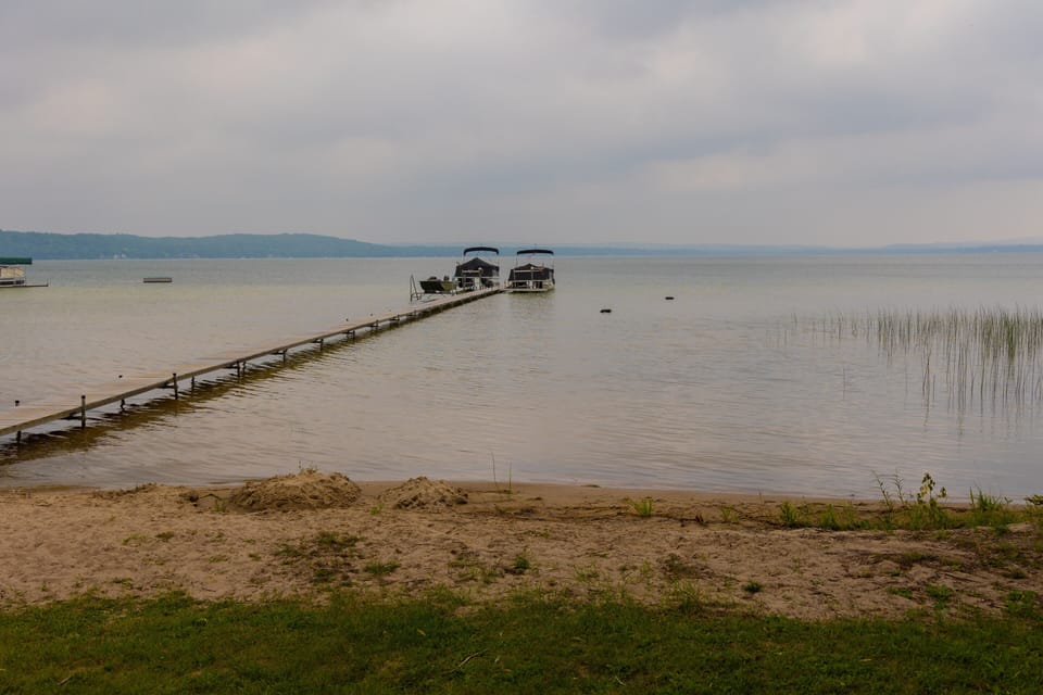 Soft sandy beach with shallow entry to the lake. 