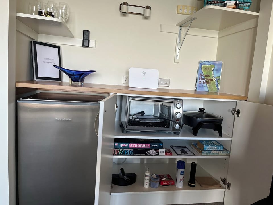 In the sitting room, extra cooking equipment - benchtop oven & frypan