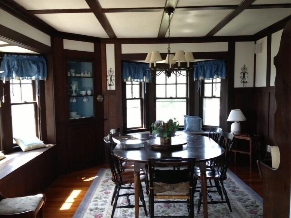 Lovely dining room with bay windows and ocean view.