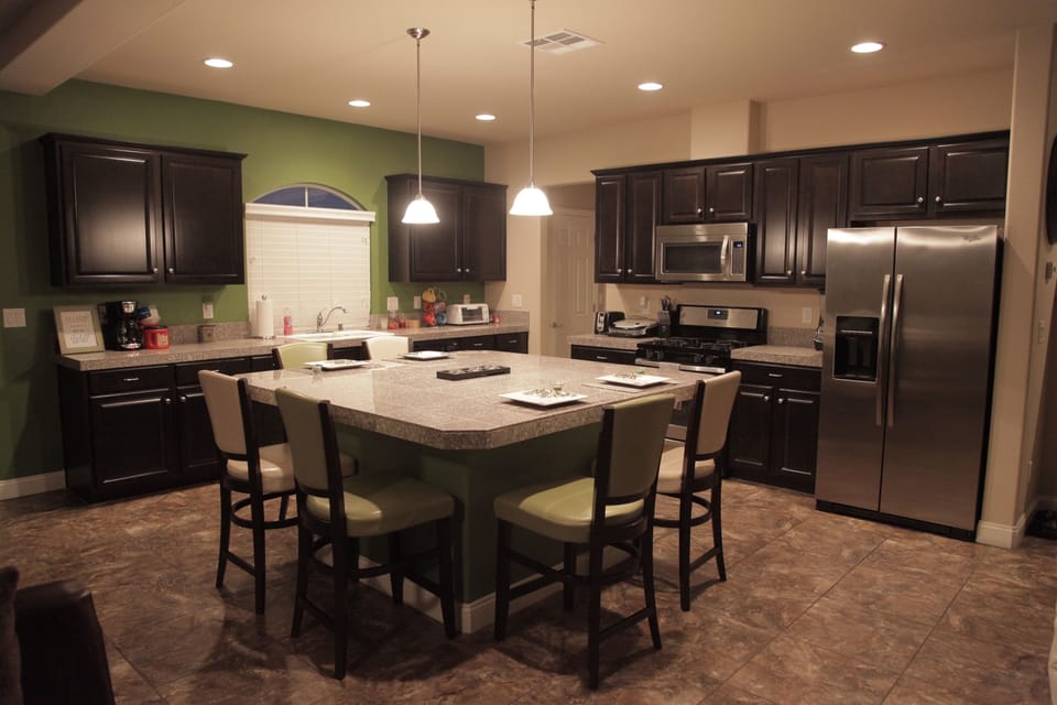 Large island located in kitchen area. Has all new stainless steel appliances.