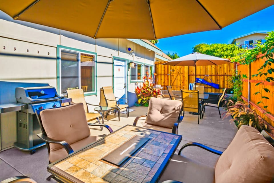Patio with firechat and plush seating and outdoor dining table for 6.