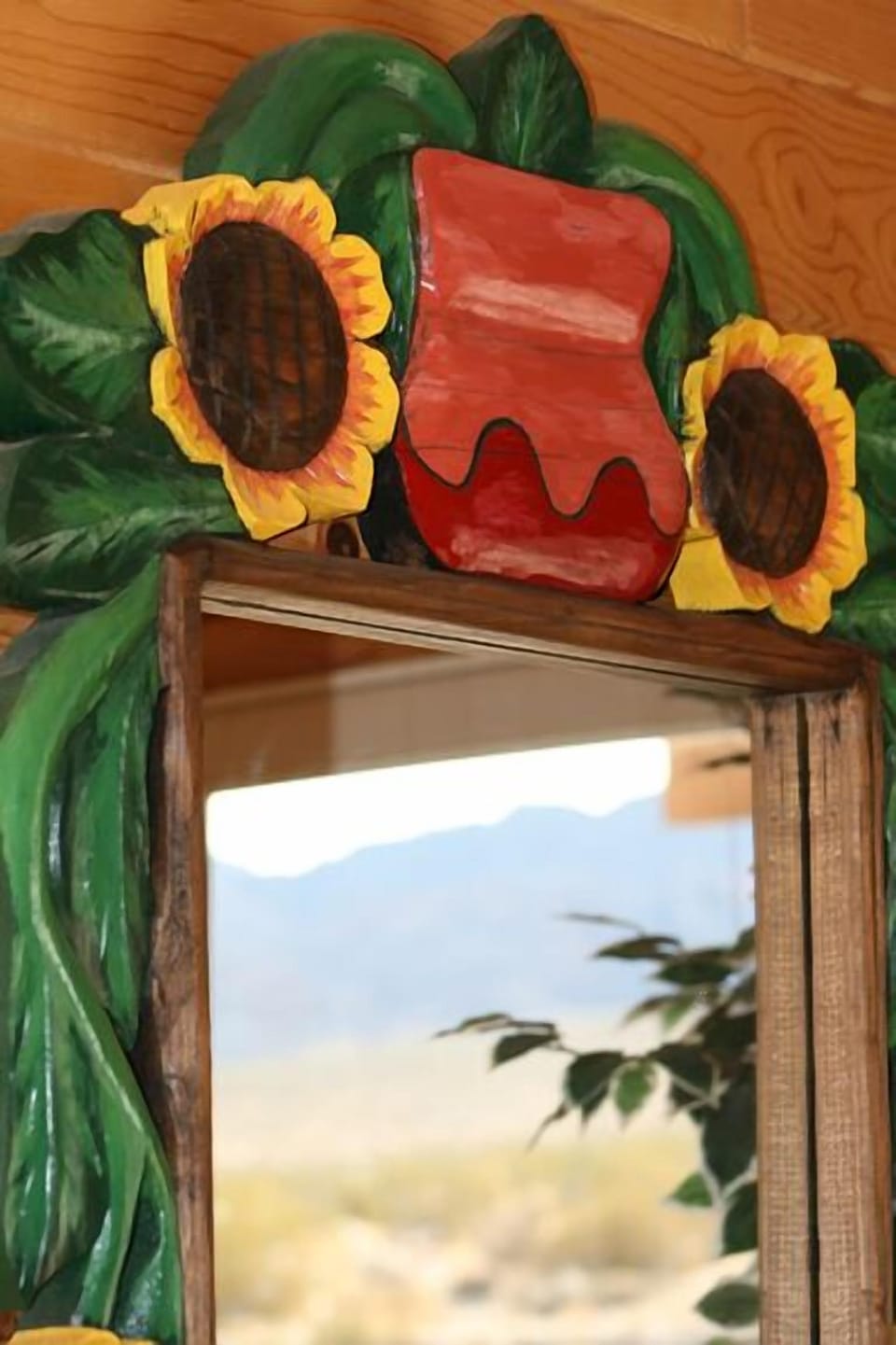 Hand carved/painted mirror in bedroom.