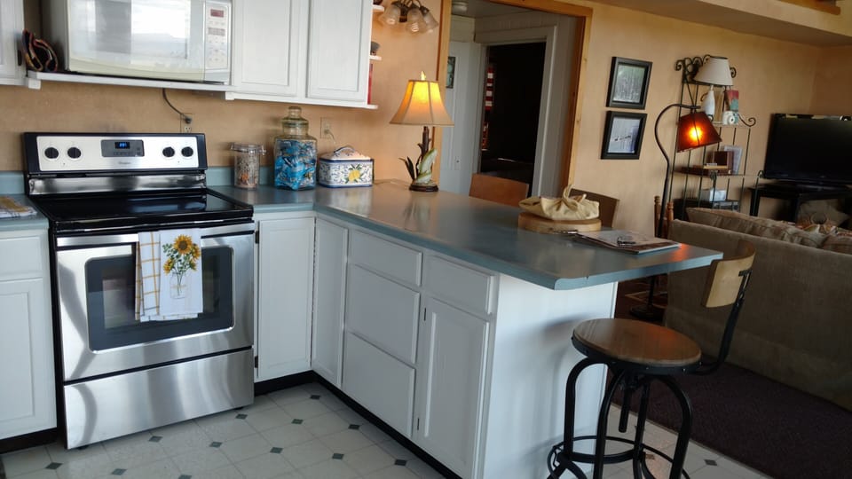 Kitchen view into the TV area. 