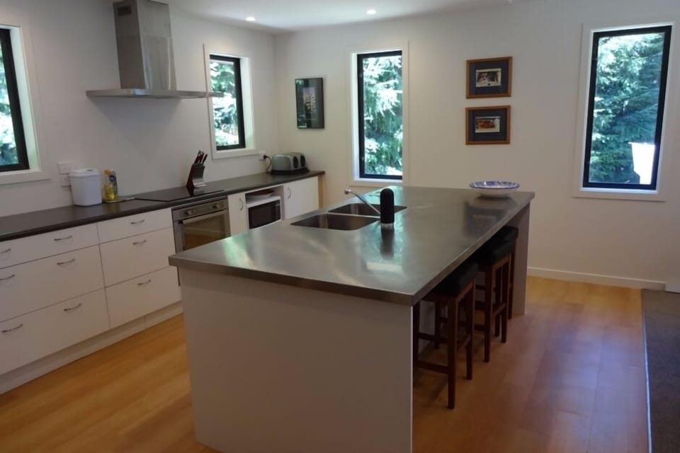 The kitchen complete with a dishwasher, oven, microwave, 2 large fridge freezers