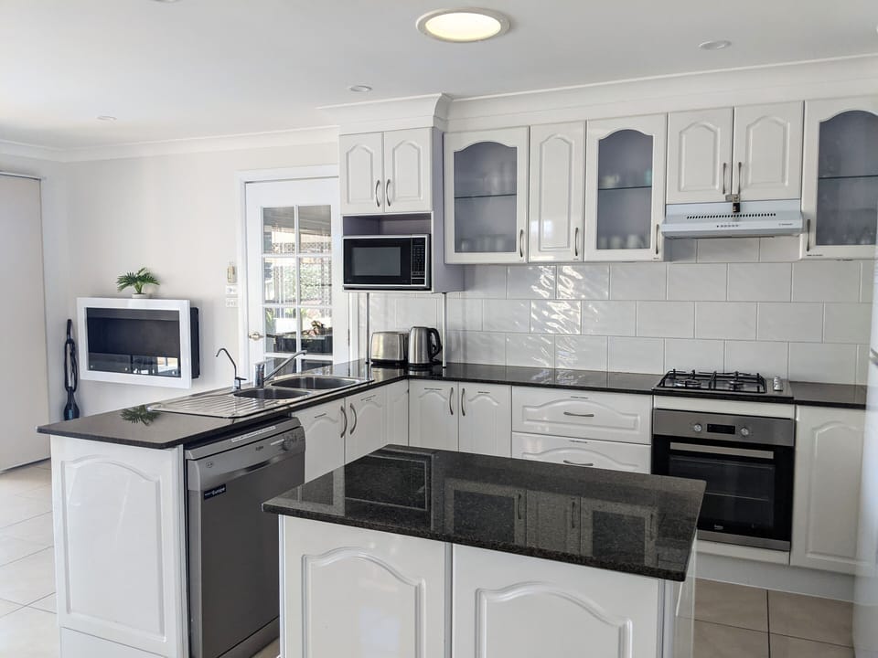 Kitchen with gas stove and electric oven 