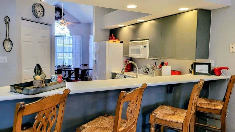 The kitchen has a large pantry for storage.