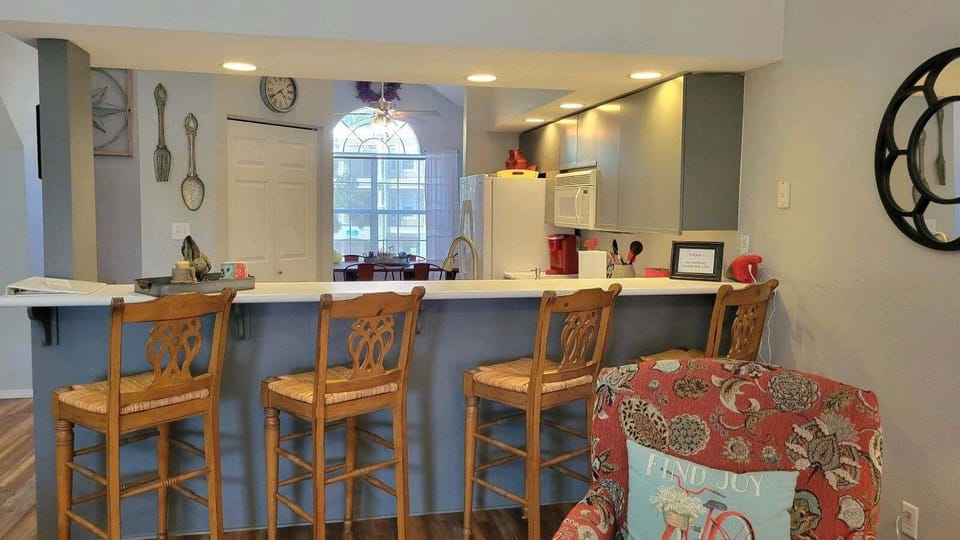The large bar separates the kitchen from the living room.