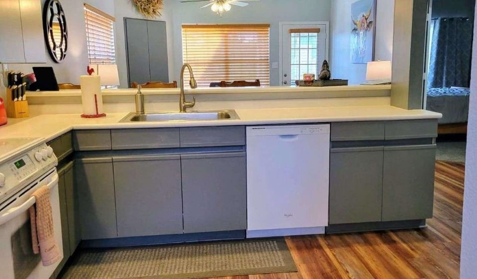 Kitchen offers service for 14 with plenty of dishes and cooking utensils.